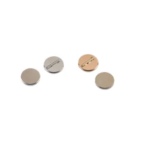 Detailed view of circular magnetic brooch converters in silver and rose gold finishes