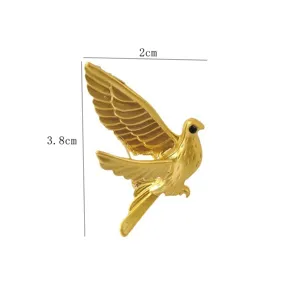 Detailed macro view of gold peace dove brooch showing the 2cm by 3.8cm dimensions clearly