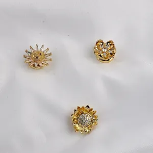 Collectie gouden magnetische broches in bloem- en zonvorm met zirkonia accenten