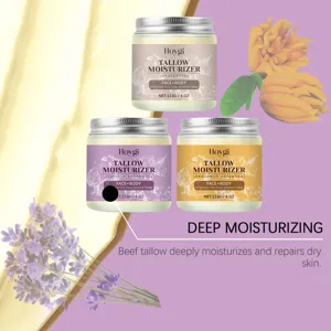 Detailed view of Hoygi grass-fed tallow face and body moisturizer jars with natural plant extracts.