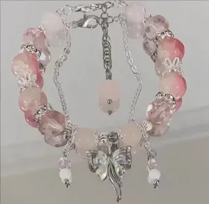 Sweet pink crystal beaded bracelet with silver butterfly charm for women fashion jewelry.