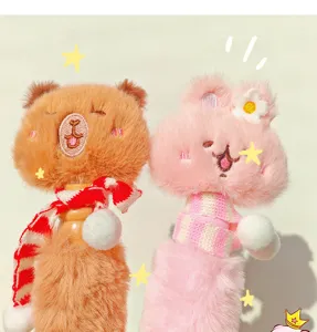 Close-up of cute plush animal ballpoint pens with knit scarves and soft stuffed toy design.