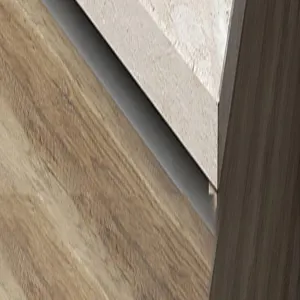 Detailed view of wooden texture cabinet surface and edge craftsmanship, high quality.