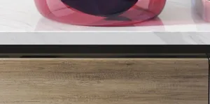 Close-up detail of the translucent pink plastic washbasin rim and smooth surface texture.