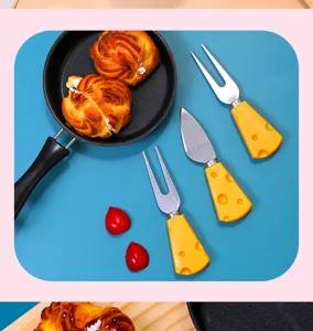 Cheese handle tableware detail view, cute butter spreader and fork set for dessert and fruit.