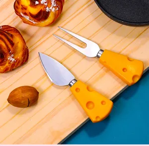 Stainless steel cheese knife and fork set with cute yellow cheese handles for butter toast.