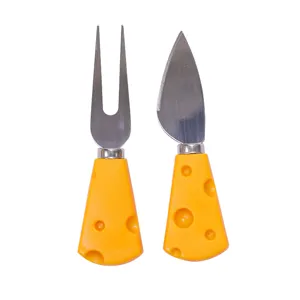 Cute cheese knife and fork set with yellow swiss cheese shaped handles for dining table.