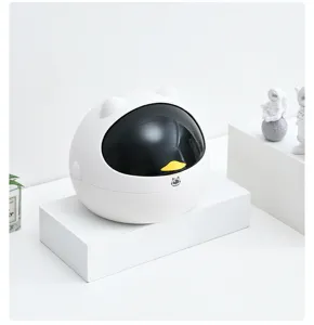 Cute mini desktop trash can detail, creative white cat ear design for bedroom desk storage.