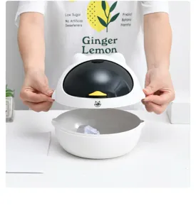 Cute mini desktop trash can with cat ears and detachable lid for home and office use.