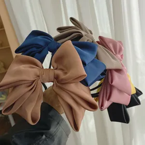 Collection of oversized satin bow headbands in various elegant colors for women's hair