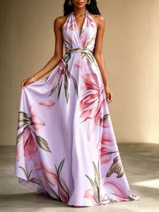 Elegant floral halter maxi dress with open back and flowing hem for summer vacation style.