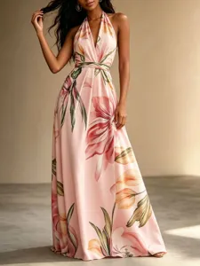 Detail view of the elegant floral halter maxi dress featuring an open back and flowy hem.