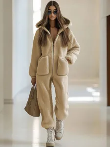 Cozy fleece hooded jumpsuit detail featuring soft fabric and front pockets for ultimate warmth.