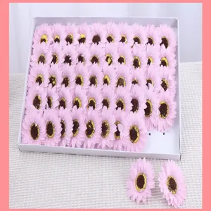Pink artificial sunflower soap flower heads in box, ideal for DIY bouquet crafting.