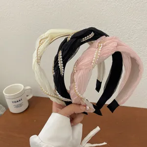 Elegante cerchietto in tessuto intrecciato con perle e strass in crema, nero e rosa