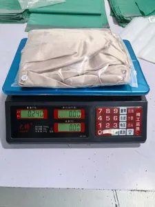 Detailed view of the satin wrap V-neck shirt packaging and weight measurement in warehouse.