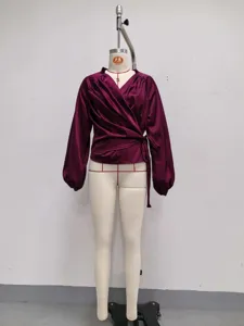 Deep purple satin wrap blouse detail, V-neck design, long bishop sleeves, side tie closure.
