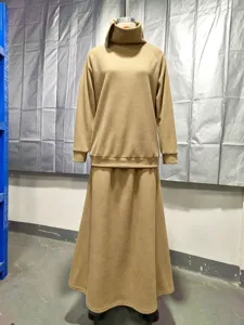 Solid color turtleneck sweatshirt and long skirt two-piece set, casual autumn winter outfit.