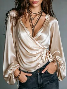 Women's satin wrap V-neck long sleeve blouse, elegant champagne top with tie waist design.