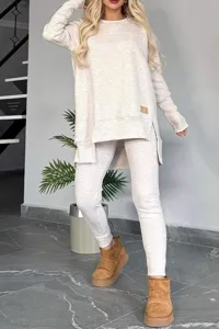 Detail view of casual fleece loungewear set featuring side slit long sleeve top and cozy leggings.
