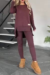 Detail view of women thermal fleece-lined long sleeve split hem top and leggings set.