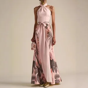 Pink halter floral maxi dress detail showcasing elegant tropical print and waist tie design.
