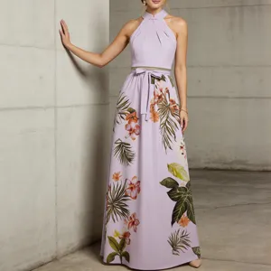Elegant lavender halter neck long dress with tropical floral print and stylish waist bow.