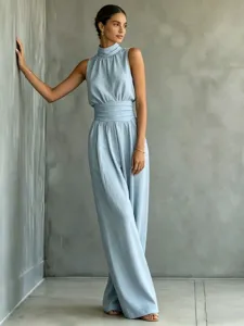Sleeveless mock neck wide leg jumpsuit detail, elegant solid color casual long pants look.
