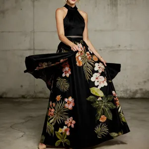 Details of the elegant floral evening dress showing flowy silhouette and tropical print.