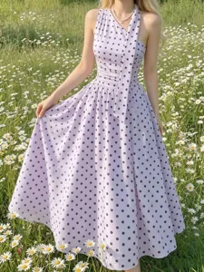 Detail of French polka dot halter midi dress, retro elegant A-line summer resort style.