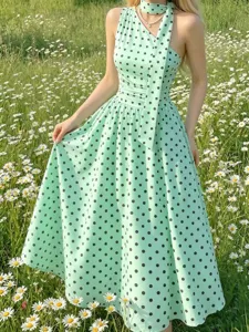 Mint green polka dot halter midi dress, vintage sleeveless summer A-line vacation style.