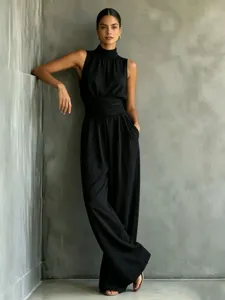 Sleeveless high-neck solid color wide-leg jumpsuit for women, elegant casual summer long pants.