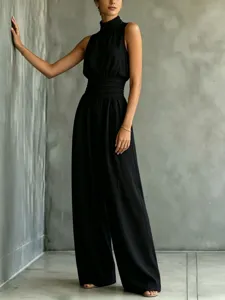Detailed view of the elegant black sleeveless high neck wide leg jumpsuit for women.