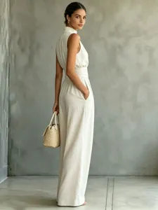 Detailed view of the elegant sleeveless high-neck wide-leg jumpsuit, solid casual style.