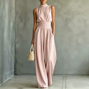Detail shot of sleeveless high neck wide leg jumpsuit in soft pink, elegant casual fashion style.
