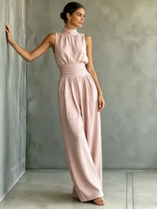 Sleeveless mock neck wide leg jumpsuit detail view in soft pink pastel fabric for summer fashion.