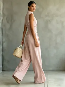 Detail view of women's sleeveless high-neck pink wide-leg jumpsuit, casual summer fashion.