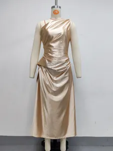 Golden satin one-shoulder pleated maxi dress, elegant evening gown close-up detail.