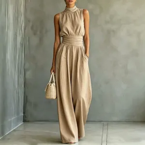 Detail view of women's sleeveless high neck wide leg jumpsuit in solid khaki for summer casual wear.