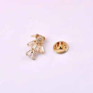 Close-up view of a cute gold-plated bear brooch with brilliant clear crystal stones