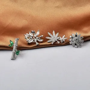 Selección de broches plateados elegantes con diseños de bambú, hojas y flores de cristal