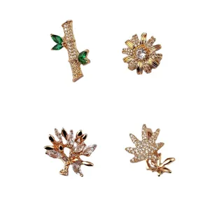 Juego de 4 broches de moda dorados con diseños de flores y hojas de cristal