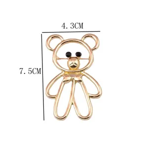 Macro view of gold teddy bear brooch with dimensions: 7.5cm height, 4.3cm width