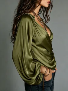 Green satin V-neck long sleeve blouse detailed view showing smooth fabric and elegant drape.