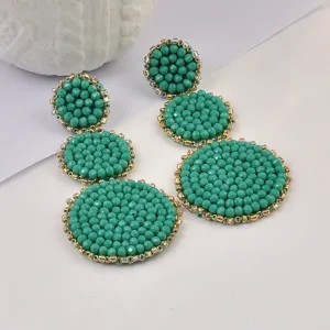 Orecchini bohémien fatti a mano con perline turchesi e dettaglio bordo dorato elegante