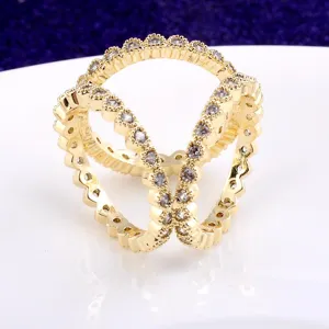 Detailed macro view of a golden three-ring scarf buckle ring decorated with clear crystals