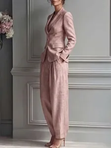 Stylish pink linen suit set featuring a tailored blazer and wide-leg trousers for women.