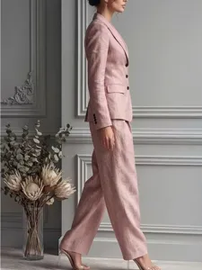 Elegant pink linen two-piece suit detail showcasing tailored blazer and matching trousers.