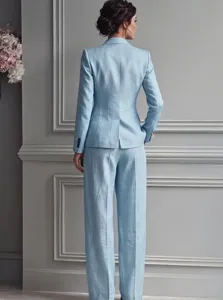 Detailed view of women casual light blue suit blazer and trousers two piece set outfit.