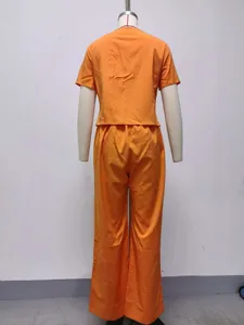 Summer casual orange two-piece set, short sleeve top and wide leg pants back view details.